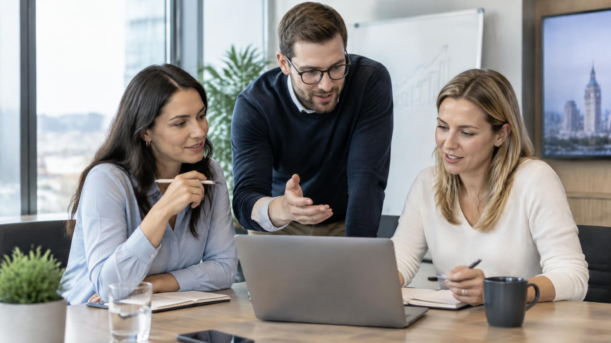 Sales team rehearsing a business presentation in an office